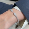 Bracciale rigido in argento con teste di serpenti